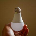 Home energy efficiency represented by an LED light bulb in a household setting