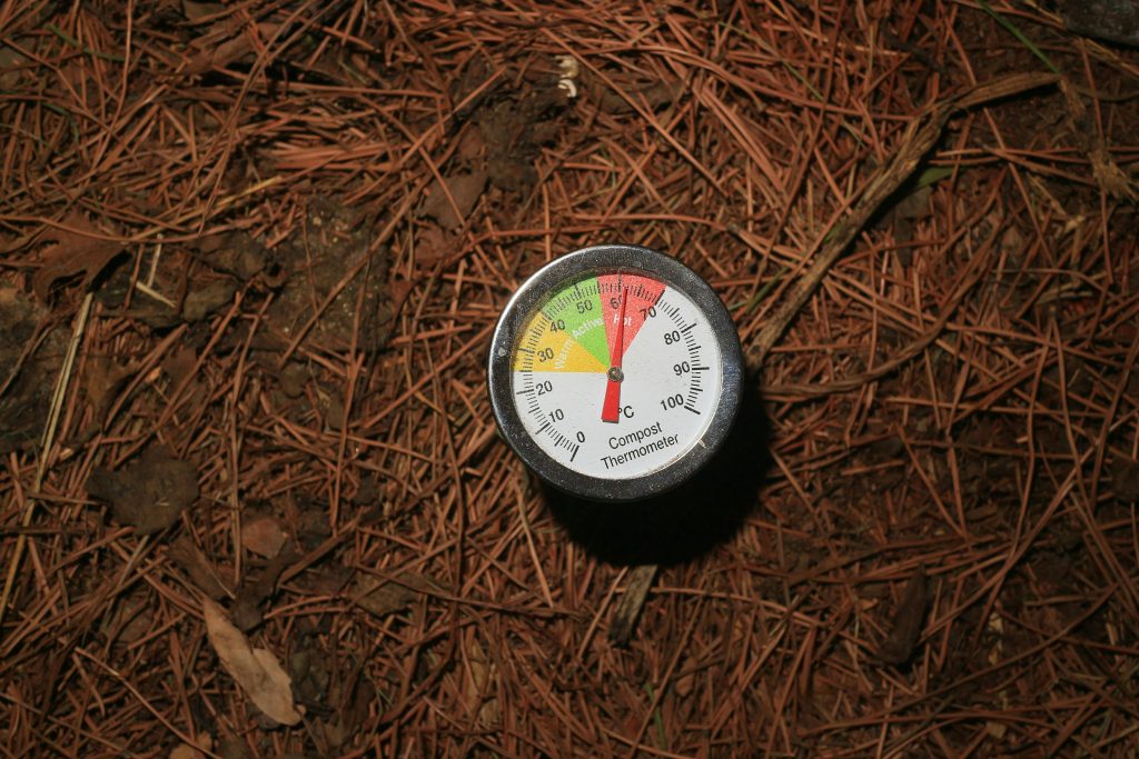 Composting basics shown with a compost thermometer in active material