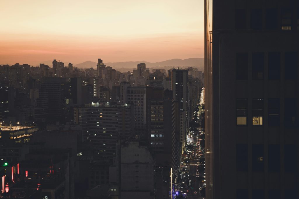 Warmer nights in urban areas where buildings hold heat after sunset
