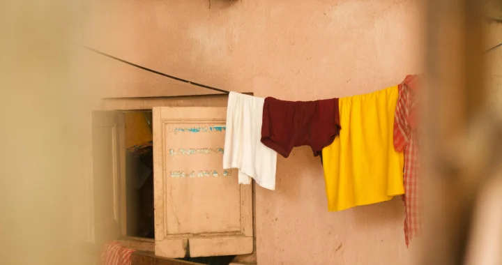 Drying clothes earlier in the day to help a home feel cooler indoors during warm weather
