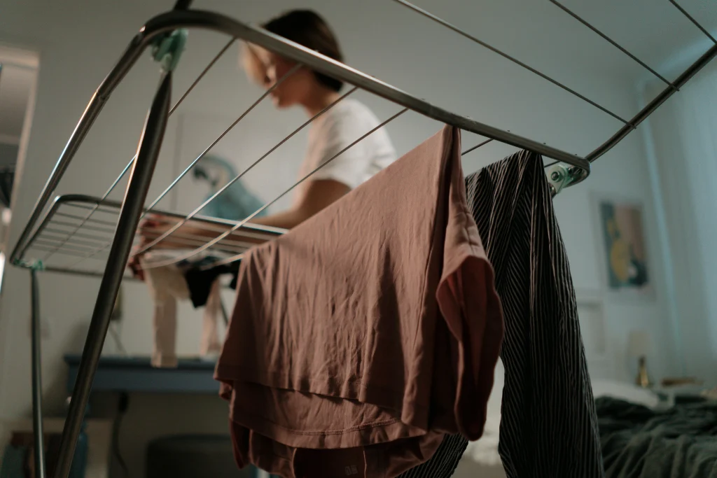 Drying clothes earlier in the day with airflow support to help keep rooms cooler indoors