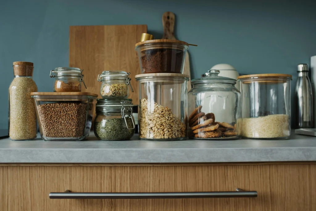 One useful low-waste habit supported by visible kitchen storage and repeatable home systems
