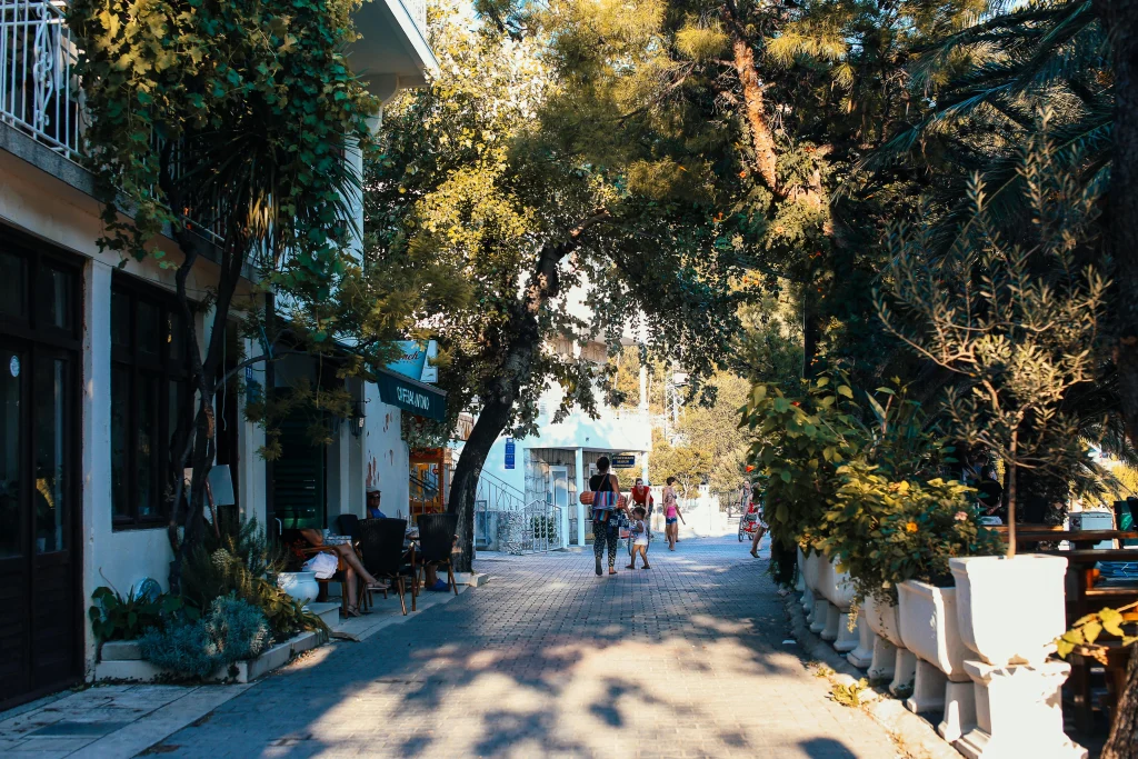 Sidewalk tree shade supporting easier summer walking on a shaded neighborhood pedestrian route