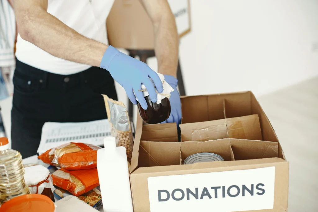 Small donation box at home holding useful items to help lower household waste