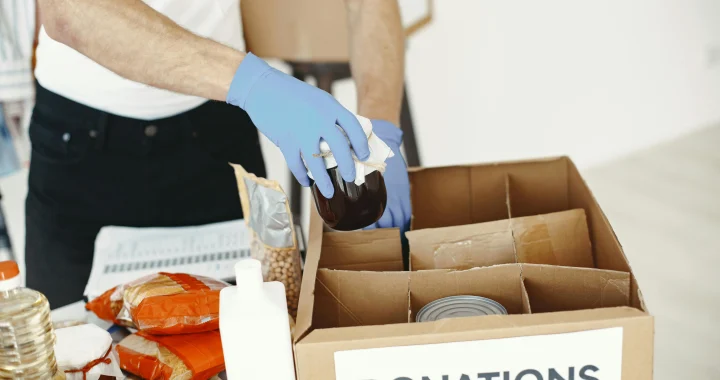 Small donation box at home holding useful items to help lower household waste