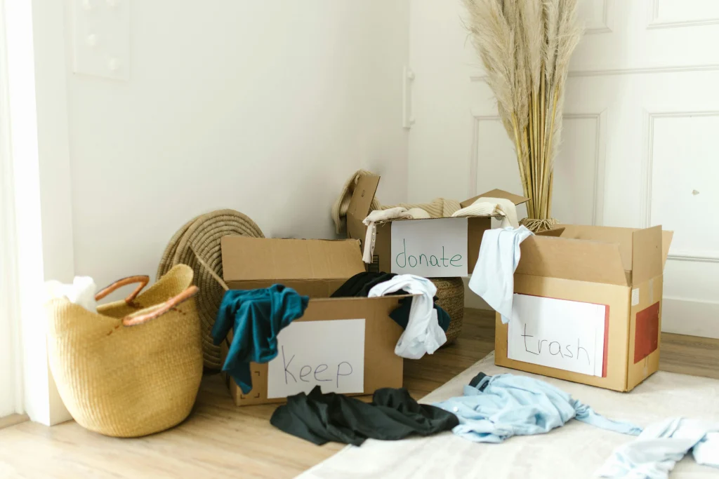 Small donation box at home kept manageable so useful items avoid the trash and leave the house sooner
