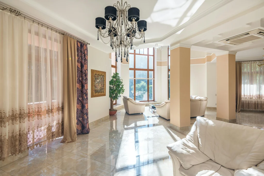 Using curtains earlier in a living room to help rooms stay cooler during hot weather