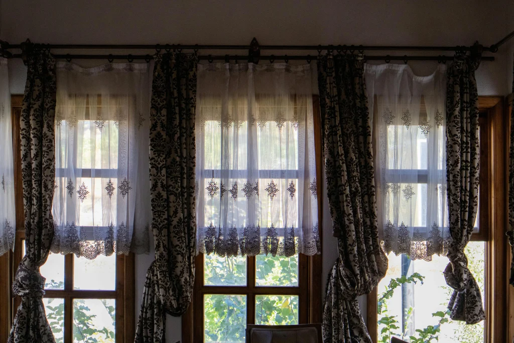 Using curtains earlier to help rooms stay cooler before direct sun heats the home