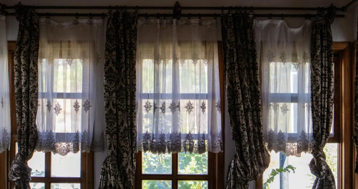 Using curtains earlier to help rooms stay cooler before direct sun heats the home