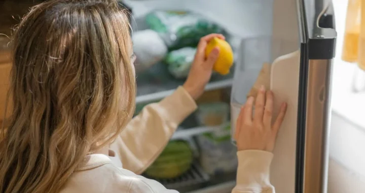 Running eat-first note on a refrigerator helping reduce forgotten food at home