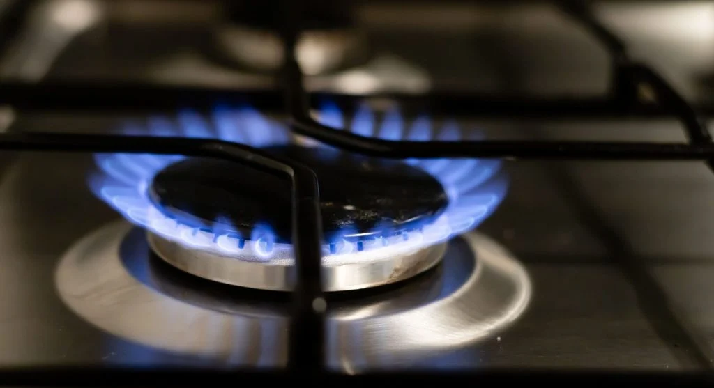 Heat-producing appliances adding warmth to a home kitchen during summer evenings