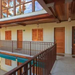 Warm balconies and patios affecting nearby indoor rooms during summer evening hours