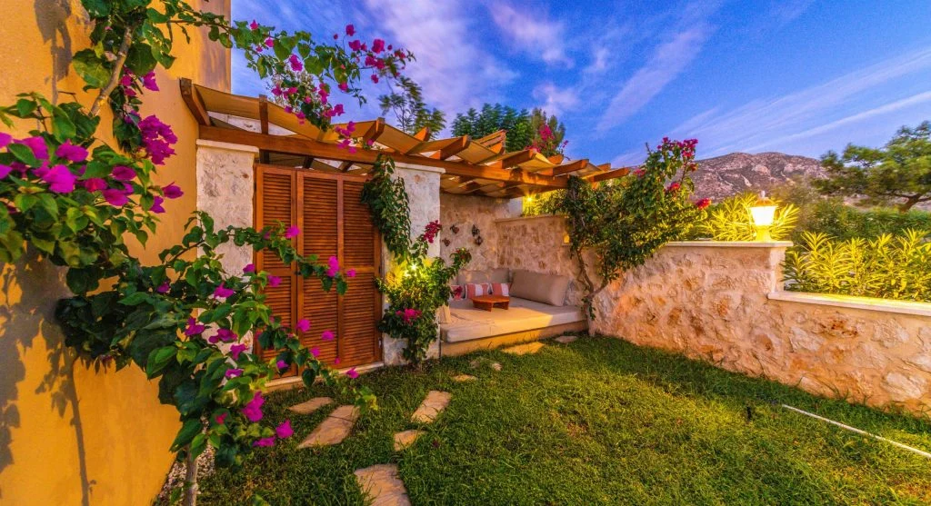 Warm patio beside a home wall affecting evening comfort in nearby indoor rooms