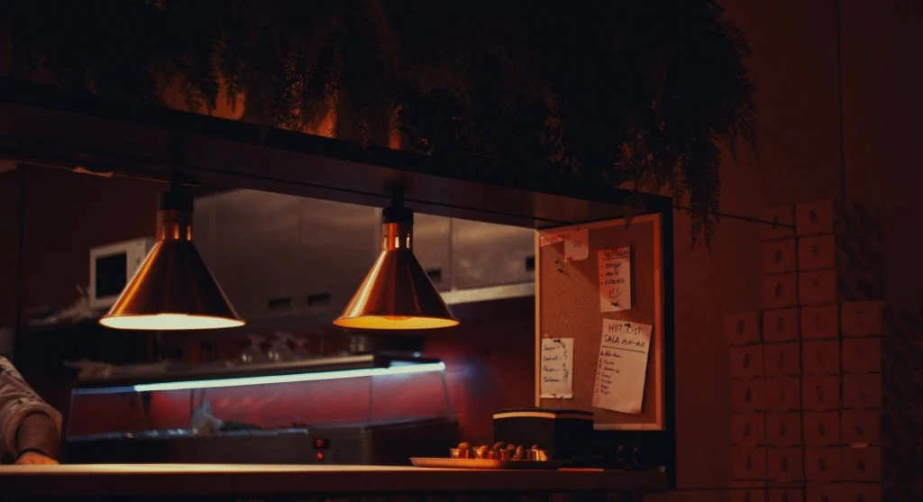 Using task lighting at night in one kitchen work area instead of lighting the whole room brightly