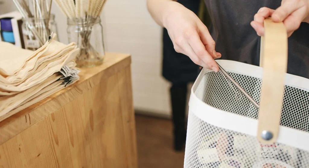 Keeping reusable shopping bags near the door with other essentials to support a low-waste routine