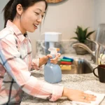 Reusable cleaning cloths within reach on a counter to help cut household waste during daily cleaning