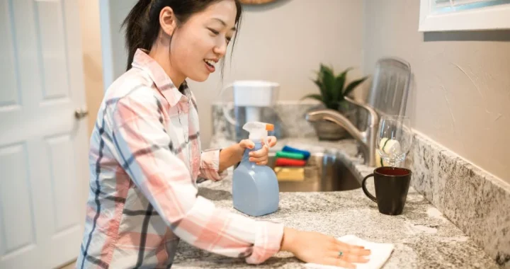 Reusable cleaning cloths within reach on a counter to help cut household waste during daily cleaning