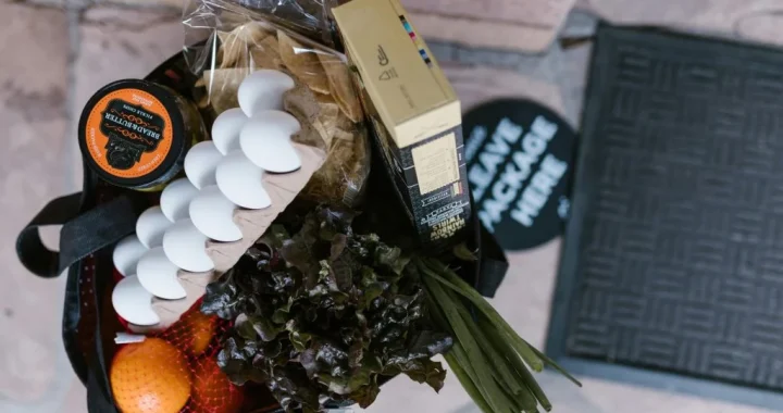 Keeping reusable shopping bags near the door to help households waste less on everyday errands