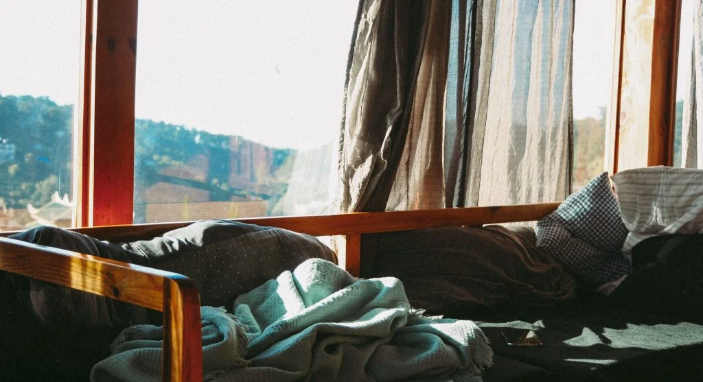 Afternoon heat building in a bedroom before sunset during summer