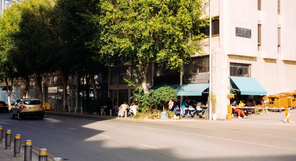 Small patch of shade over pavement during hot daylight hours changing outdoor comfort