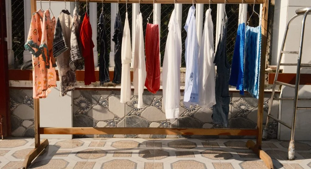 Drying laundry in smaller batches on a drying rack with better airflow between clothes